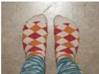 Bild karierter Socken. Weiß-rot-orange